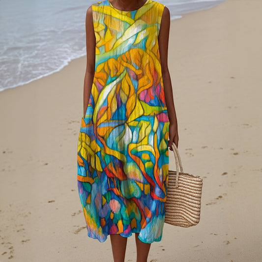Person wearing a colorful sleeveless dress on a beach